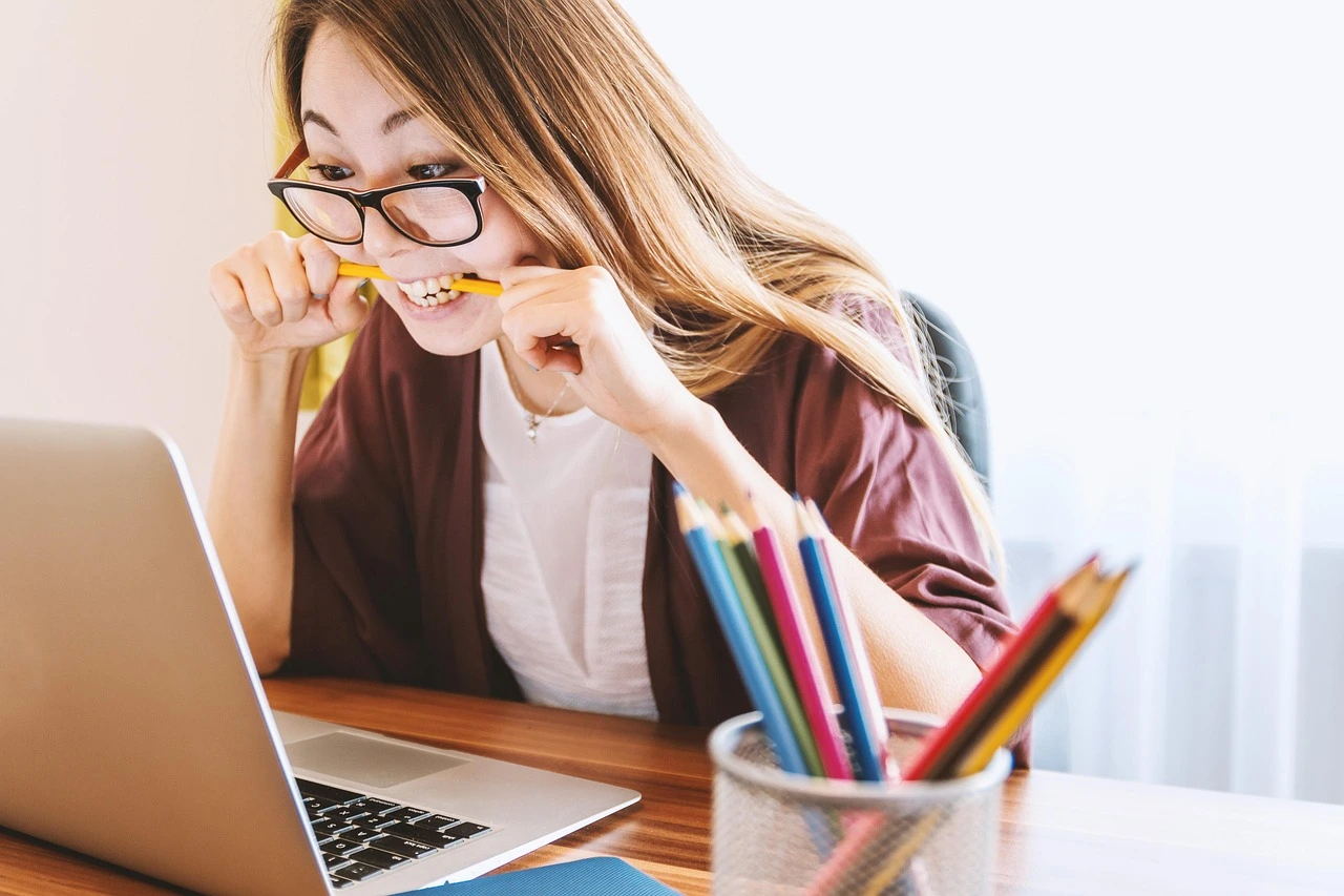 Student using a laptop while researching